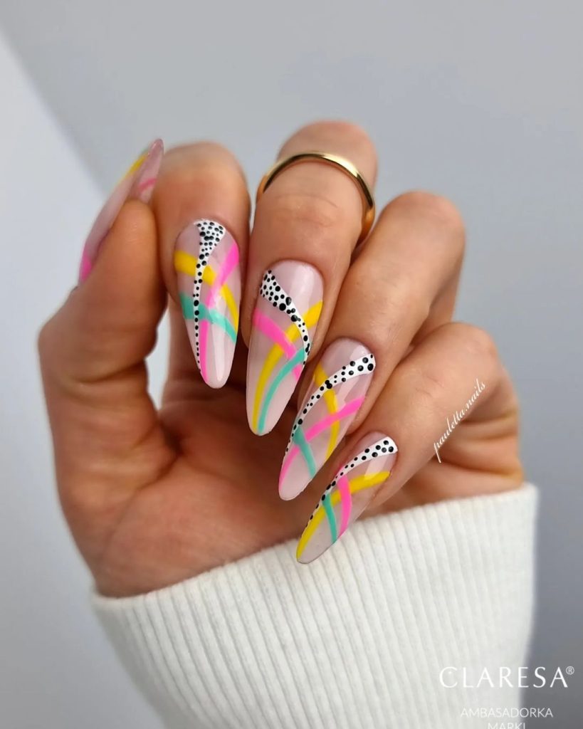 pink, blue, and yellow swirl nails