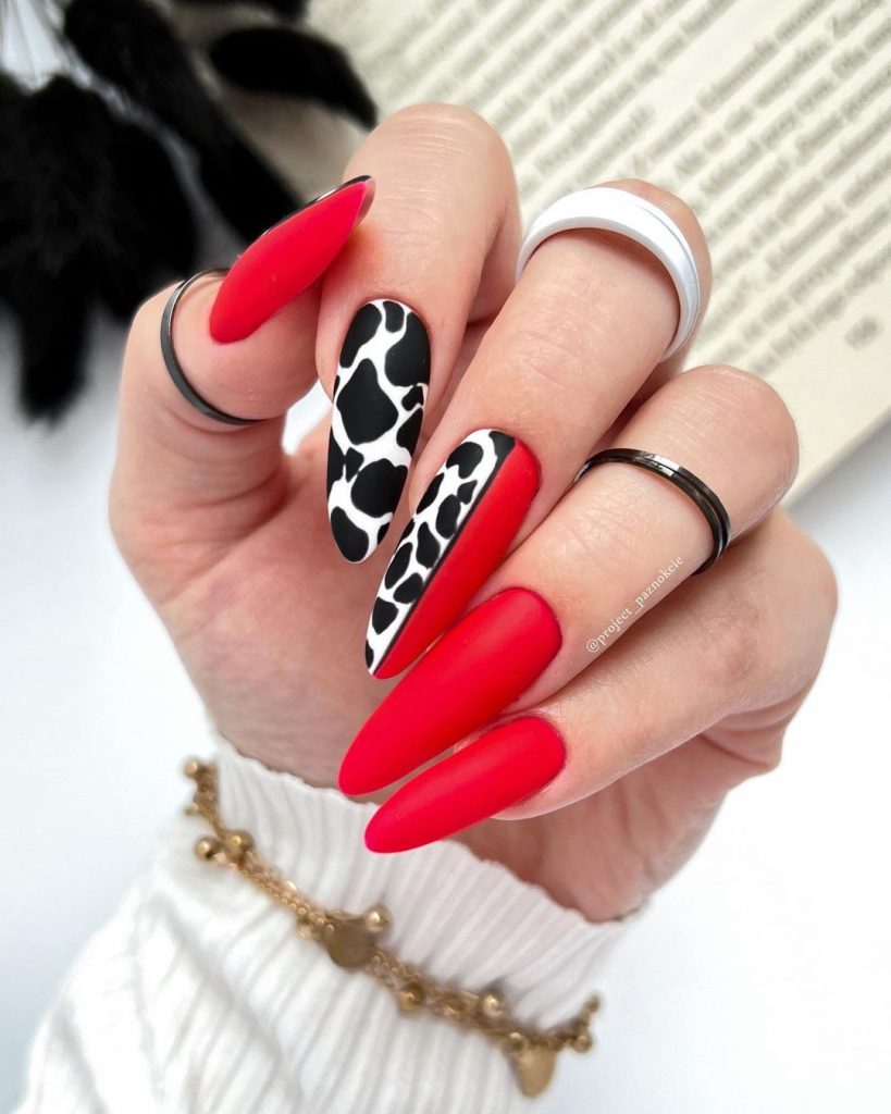 red and black cow print nails