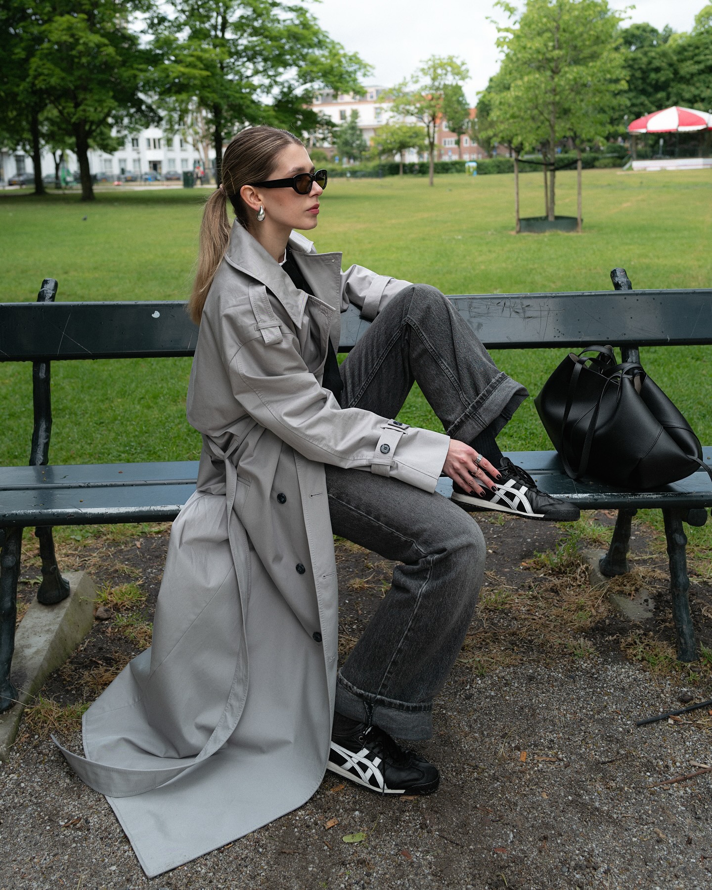 Oversized Grey Trench Coat + Black Cardigan + Grey Jeans + Black Sneakers